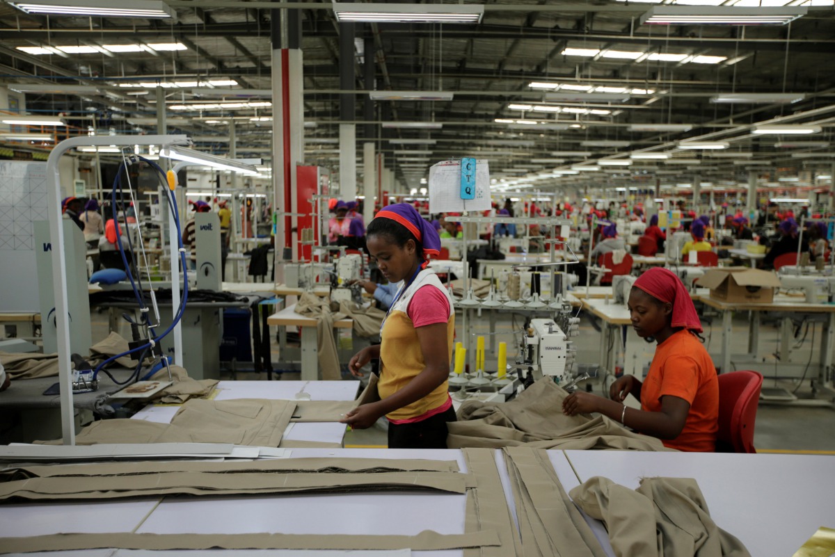 Workers arrange pieces of fabric inside the Indochine Apparel PLC textile factory in Hawassa Industrial Park in Southern Nations, Nationalities and Peoples region, Ethiopia November 17, 2017.  Reuters/Tiksa Negeri