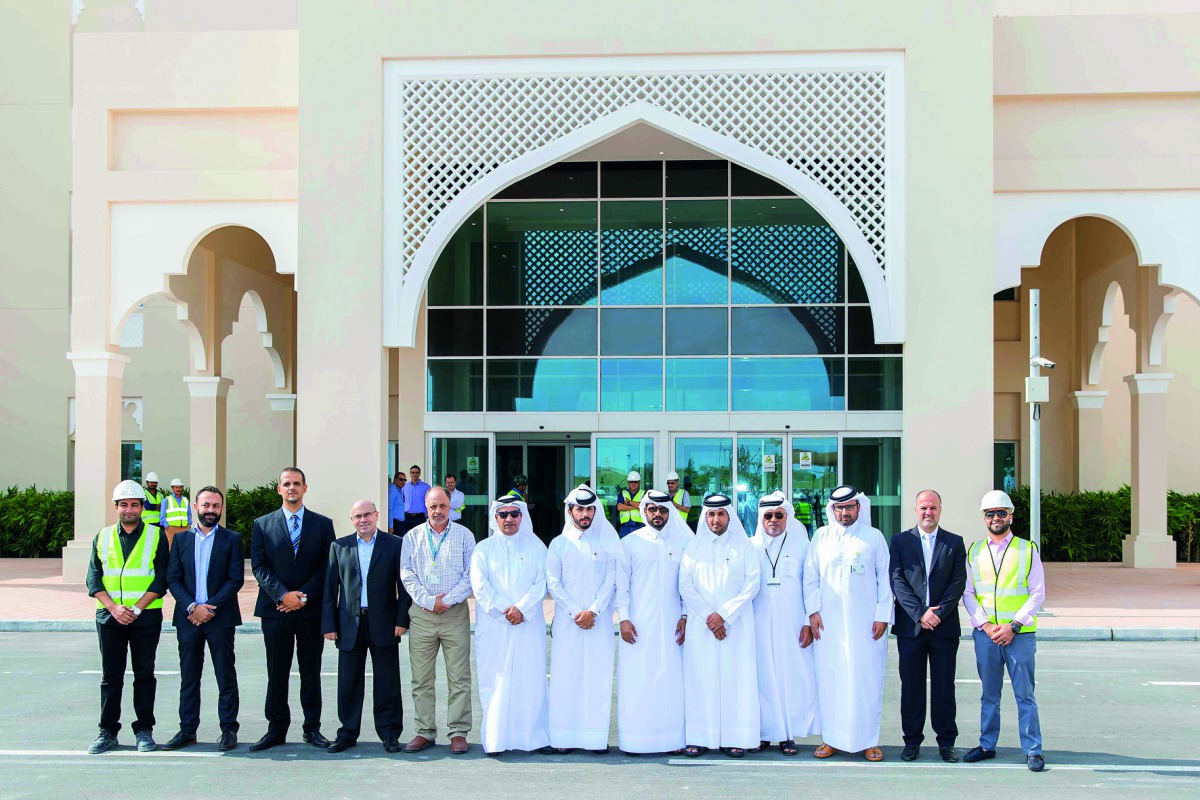 Officials pose for a group picture at the handing over ceremony.
