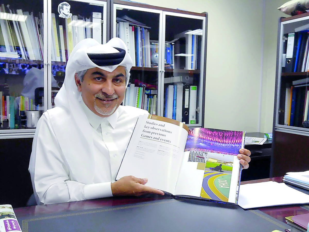 Author and sports administrator Abdulla Y Al Mulla poses for a photograph with his book titled ‘Perfect Pitch’.