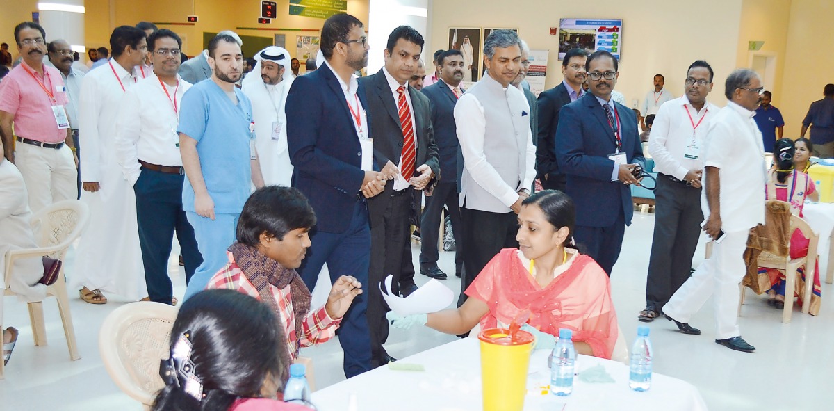 Indian Ambassador P Kumaran touring the medical camp with officials.