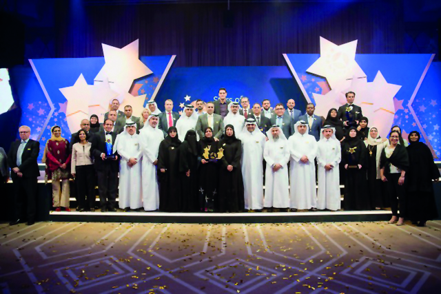 Minister of Public Health H E Dr Hanan Mohamed Al Kuwari with the winners and other officials at the ceremony.