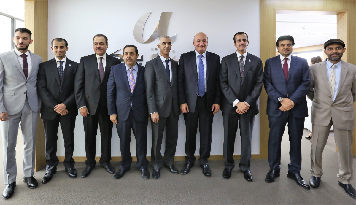 Sheikh Dr Khalid bin Thani bin Abdullah Al Thani (third right) Chairman of the Board of Directors and Managing Director of Qatar International Islamic Bank (QIIB),  Abdulbasit Ahmad Al Shaibei (second right), QIIB Chief Executive Officer and other officia
