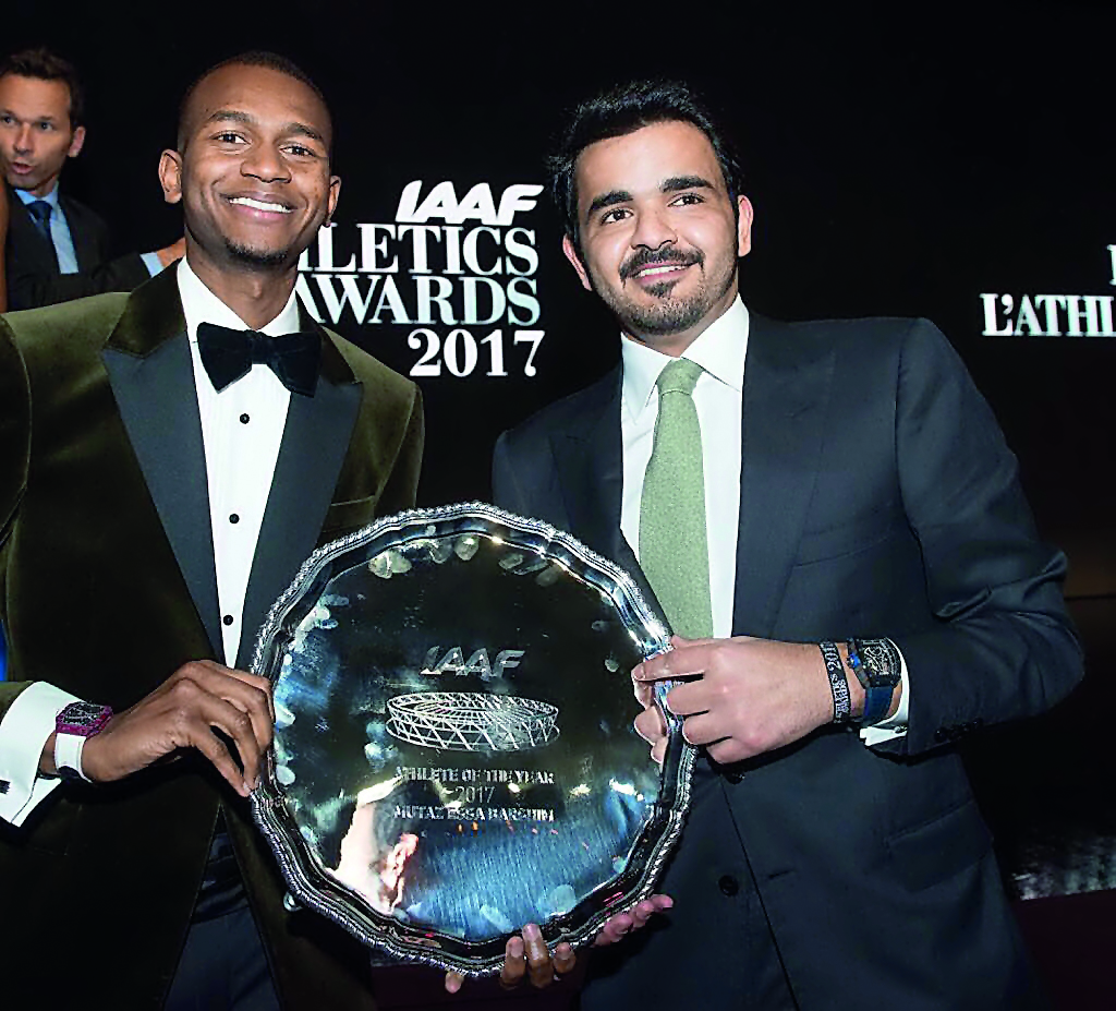 Qatar Olympic Committee President H E Sheikh Joaan bin Hamad Al Thani with Mutaz Essa Barshim after he won the World Athlete of the Year 2017 trophy at the IAAF Awards in Monaco on Friday. RIGHT: Barshim poses for photographs with IAAF President Sebastian