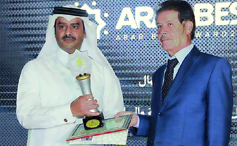 QEWC Public Relations and Shareholders Affairs Manager Rashid bin Nasser Al Hajri receiving the awards during the ceremony.