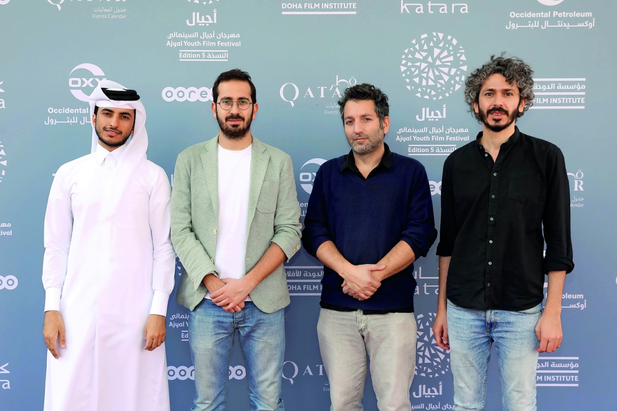Short film makers Khalifa AlMarri, Karim Rahbani, Jeremie Reichenbach and Ahmad Saleh pose for photograph during the Ajyal Youth Film Festival in Doha, yesterday. 