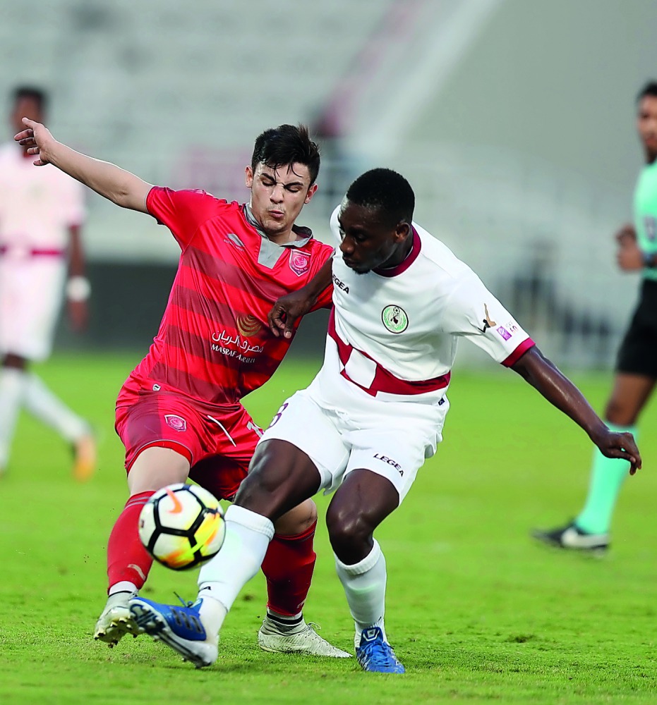 Players vie for the ball possession during the QNB Stars League match between Al Duhail and Al Markhiya which was played at Abdulla bin Khalifa Stadium on Saturday. Al Duhail won the match 2-1 but Al Duhail coach Belmadi praised the losing side for their 