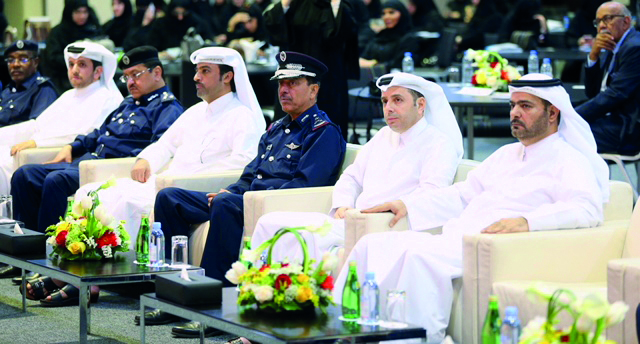 Minister of Education and Higher Education, H E Dr Mohammed Abdul Wahed Ali Al Hammadi (second right) and Director-General of Public Security, Staff Major General Saad bin Jassim Al Khulaifi (third right) with other officials from the two ministries durin