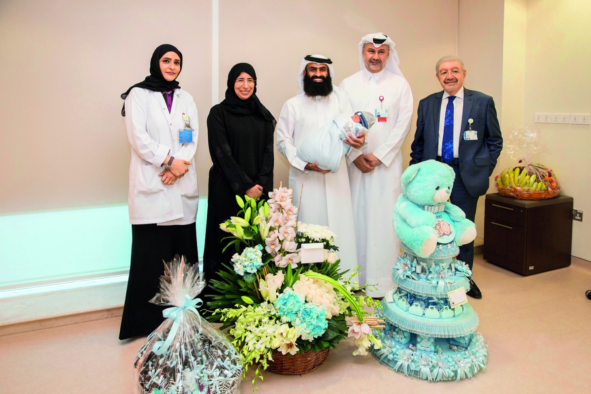 H E Dr Hanan Mohamed Al Kuwari, Minister of Public Health, with the newborn baby, parents and medical staff. 
