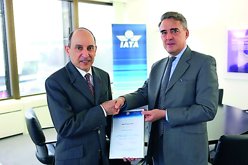 Qatar Airways Group Chief Executive Akbar Al Baker receiving the IEnvA Stage 2 certificate from Alexandre de Juniac, Director-General and Chief Executive Officer of IATA, in Geneva.