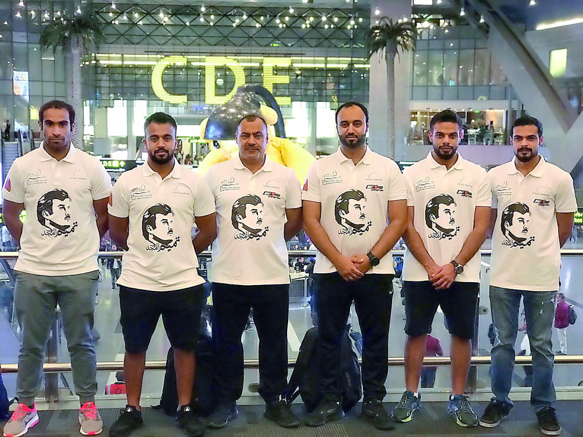 Qatari aquabike riders Waleed Mahmoud Al Sharshani and Ali Mohammed Al Nuaimi pose for a photograph with team officials prior to their departure for Thailand at the Hamad International Airport yesterday.