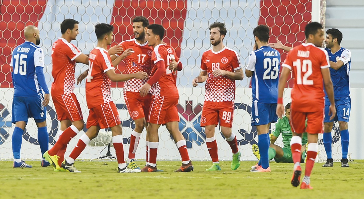 Al Arabi’s Gaser Zakaria (centre) celebrates with team-mates after scoring their first goal against Al Khor during the QNB Stars League match played at Al Arabi Stadium yesterday.