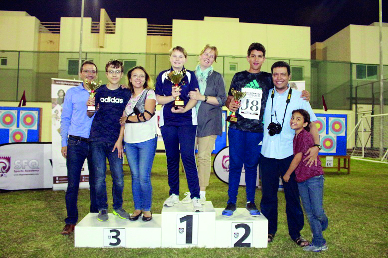 Some of the winners of the tournament with their trophies.