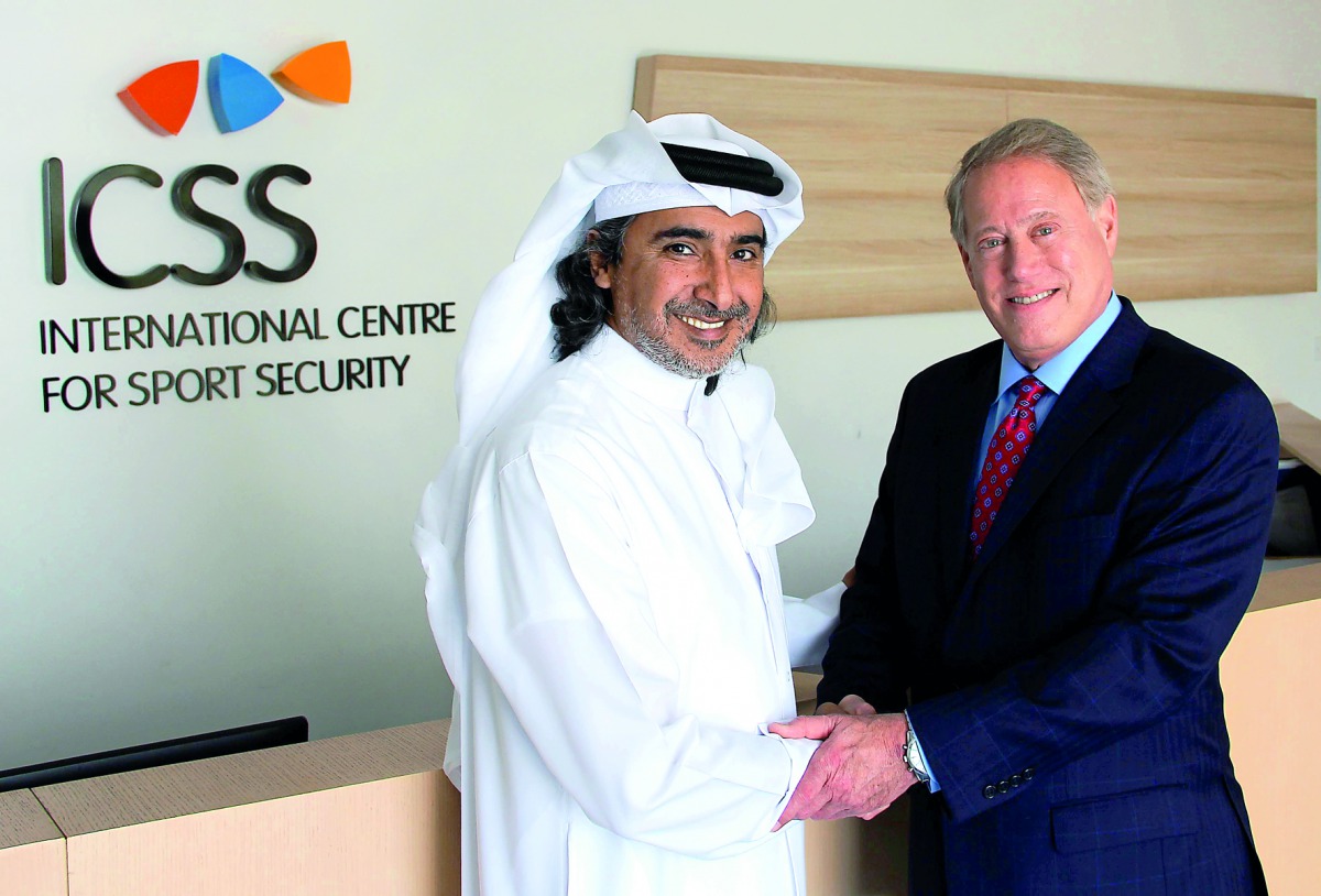This file photo shows ICSS President Mohammed Hanzab of Qatar and Michael Hershman, ICSS Group CEO.