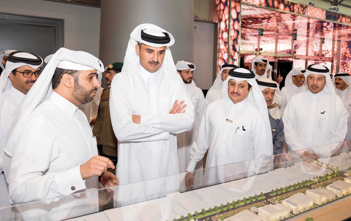 Emir H H Sheikh Tamim bin Hamad Al Thani visiting a pavilion after inaugurating the ‘Made in Qatar’ exhibition at Doha Exhibition and Convention Center, yesterday.