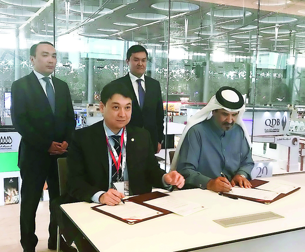 Mohammed bin Ahmed bin Towar (right), Vice-President of Qatar Chamber; and Ian Yarinov, President of the International Chamber of Kazakhstan sign the cooperation deal on the sidelines of ‘Made in Qatar’ expo, at Doha Exhibition and Convention Center.