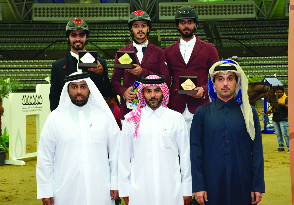 The podium winners of Medium Tour - Art. 238.2.2, 120/130 cm event of the fourth leg of Hathab Series, Hamad Nasser Al Qadi (top centre), Hussain Said Haidan and Mubarak Yousuf Al Rumaihi pose for a photograph with Omar Al Mannai, Commercial Manager of Al