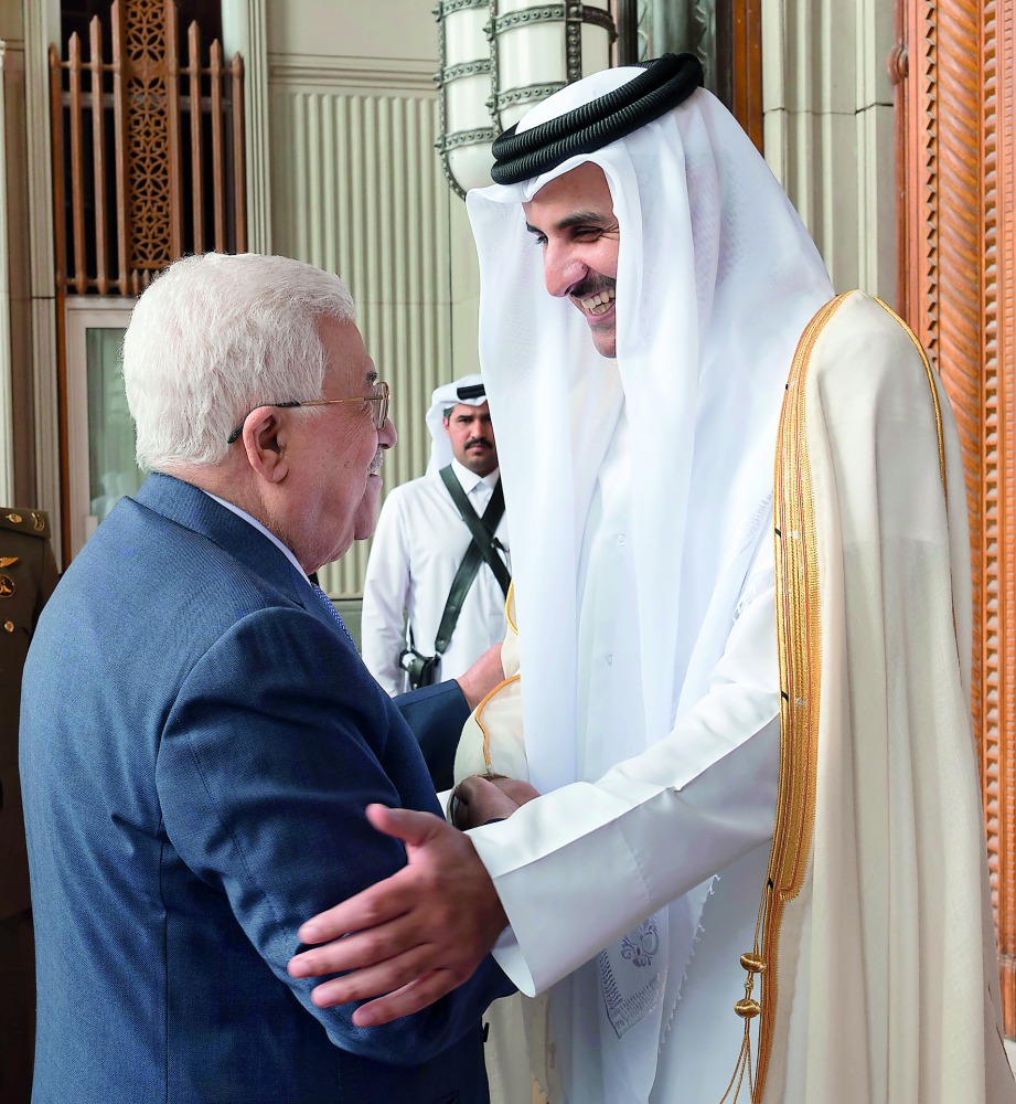 Emir H H Sheikh Tamim bin Hamad Al Thani receiving Palestinian President Mahmoud Abbas.