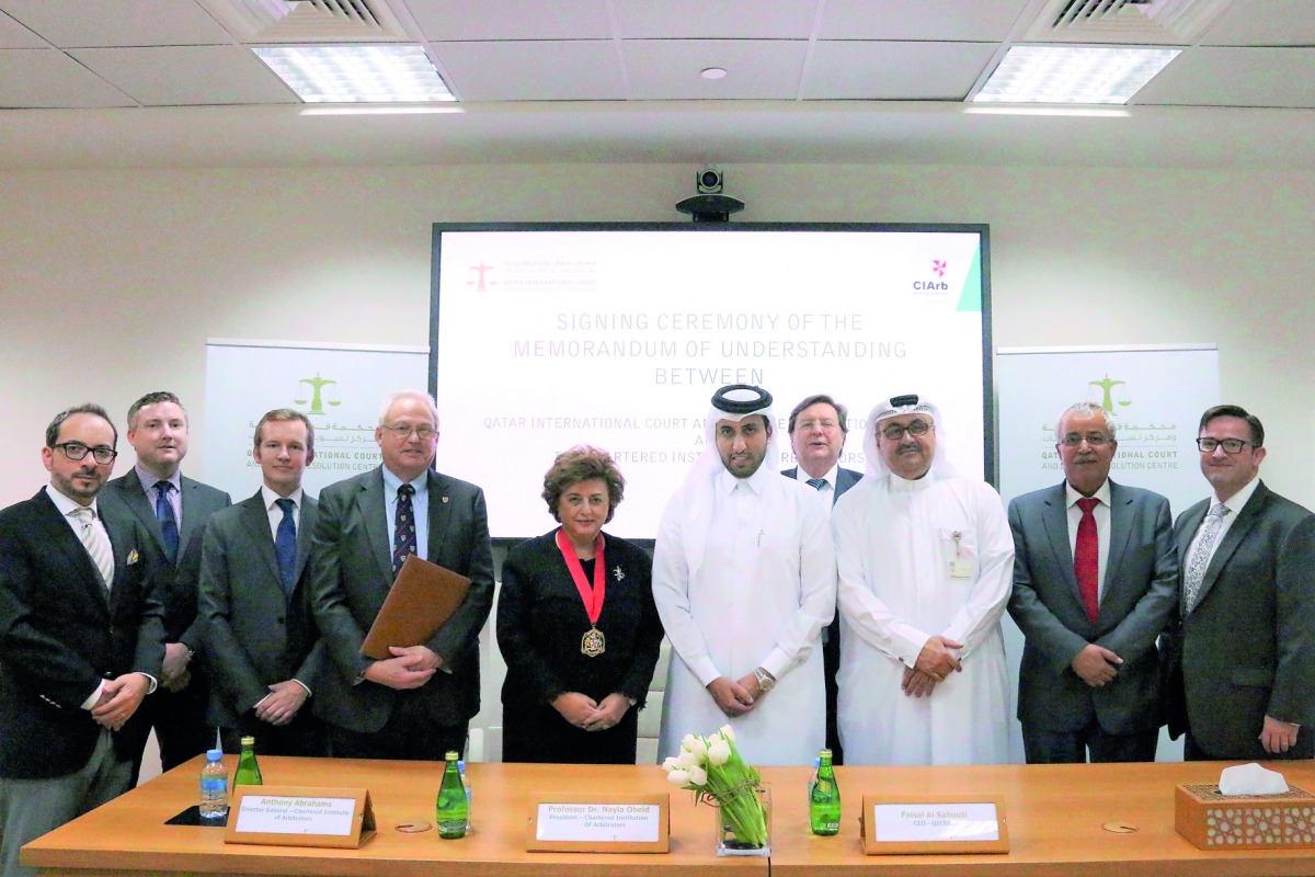 Faisal Al Sahouti (sixth left), QICDRC CEO;  and Professor Dr Nayla Comair Obeid (fifth left) CIArb President 2017, with officials of QICDRC and CIArb during the MoU signing event.