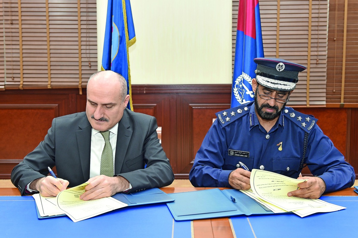 Director-General of the Police College Brigadier Mohammed Abdullah Al Muhana Al Marri and the President of the Academy Dr Yilmaz Shulat at the signing event.