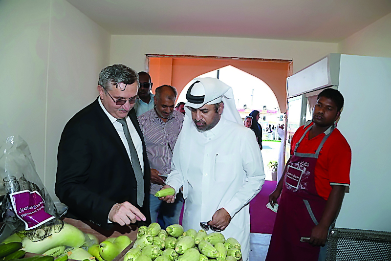 Katara General Manager Dr. Khalid bin Ibrahim Al Sulaiti briefs  an Ambassador on various local products available at Mahaseel Festival. 