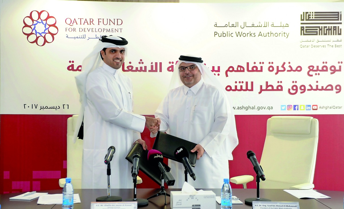 Khalifa bin Jassim Al Kuwari, the Director General of Qatar Fund for Development, and Dr. Eng. Saad bin Ahmad Al Muhannadi, President of ‘Ashghal’ during the ceremony held at Ashghal’s building yesterday. Pic: Abdul Basit / The Peninsula