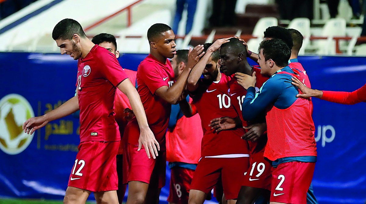 Qatari players celebrate a goal against Iraq during their Gulf Cup game on Tuesday in Kuwait City. Picture: Hussein Sayed