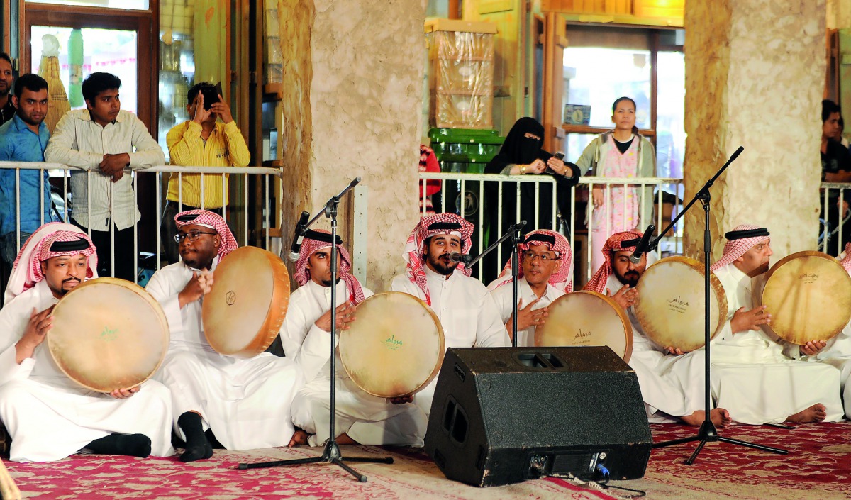 A traditional Qatari band enthrals the crowd with their performance at Al Ahmed Square in Souq Waqif yesterday as part of the Souq Waqif Spring Festival. Pic: Abdul Basit / The Peninsula