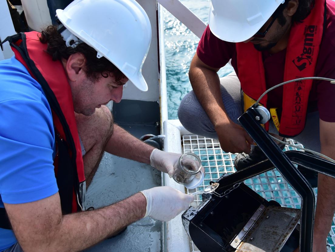 Participants of the scientific team doing research during their trip to the northwestern region of Qatar. 