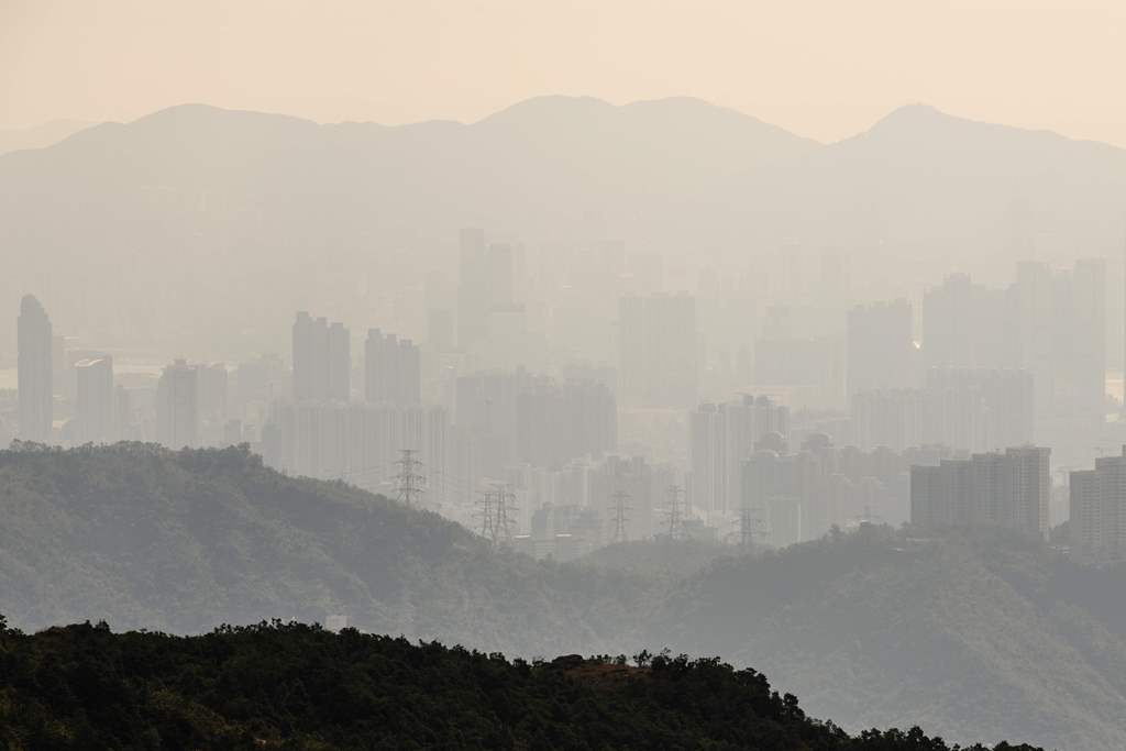This picture taken on December 14, 2017 shows a general view of buildings seen from Hong Kong's highest peak Tai Mo Shan. AFP / Anthony Wallace 