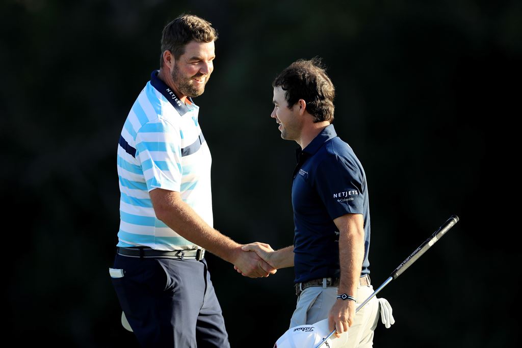 Marc Leishman of Australia and Brian Harman of the United States shake hands after finishing on the 18th green during the second round of the Sentry Tournament of Champions at Plantation Course at Kapalua Golf Club on January 5, 2018 in Lahaina, Hawaii. S