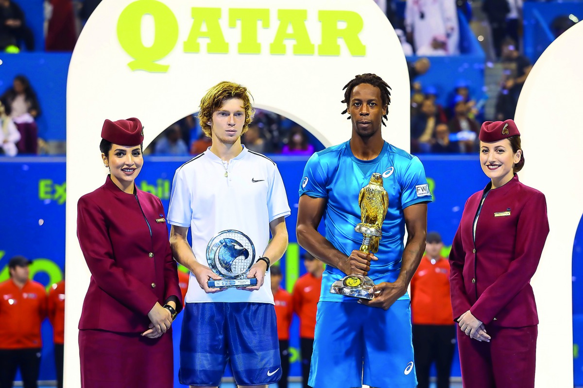 Gael Monfils and Andrey Rublev with their trophies.