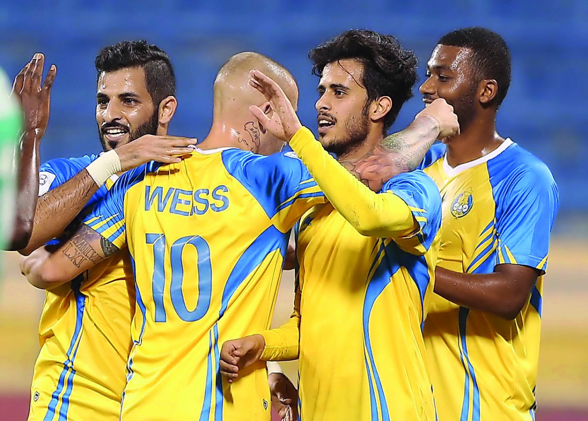 Al Gharafa players celebrate a goal during the QNB Stars League match in this file picture.