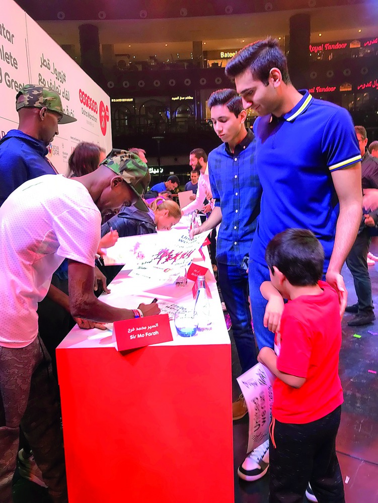 Marathon enthusiasts register for their participation at the Ooredoo Doha Marathon.