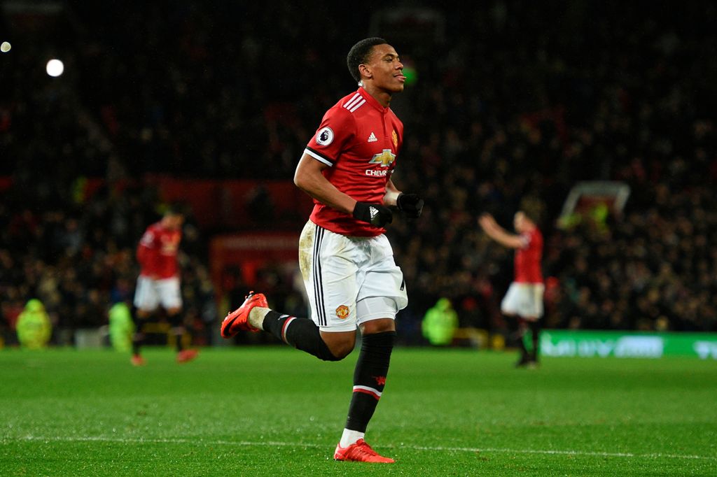 Manchester United's French striker Anthony Martial celebrates scoring their second goal during the English Premier League football match between Manchester United and Stoke City at Old Trafford in Manchester, north west England, on January 15, 2018.   AFP