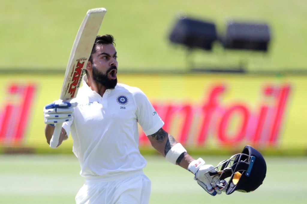 File photo of India's captain Virat Kohli raising his bat and helmet as he celebrates scoring a century (100 runs) during the third day of the second Test cricket match between South Africa and India at Supersport cricket ground on January 15, 2018 in Cen
