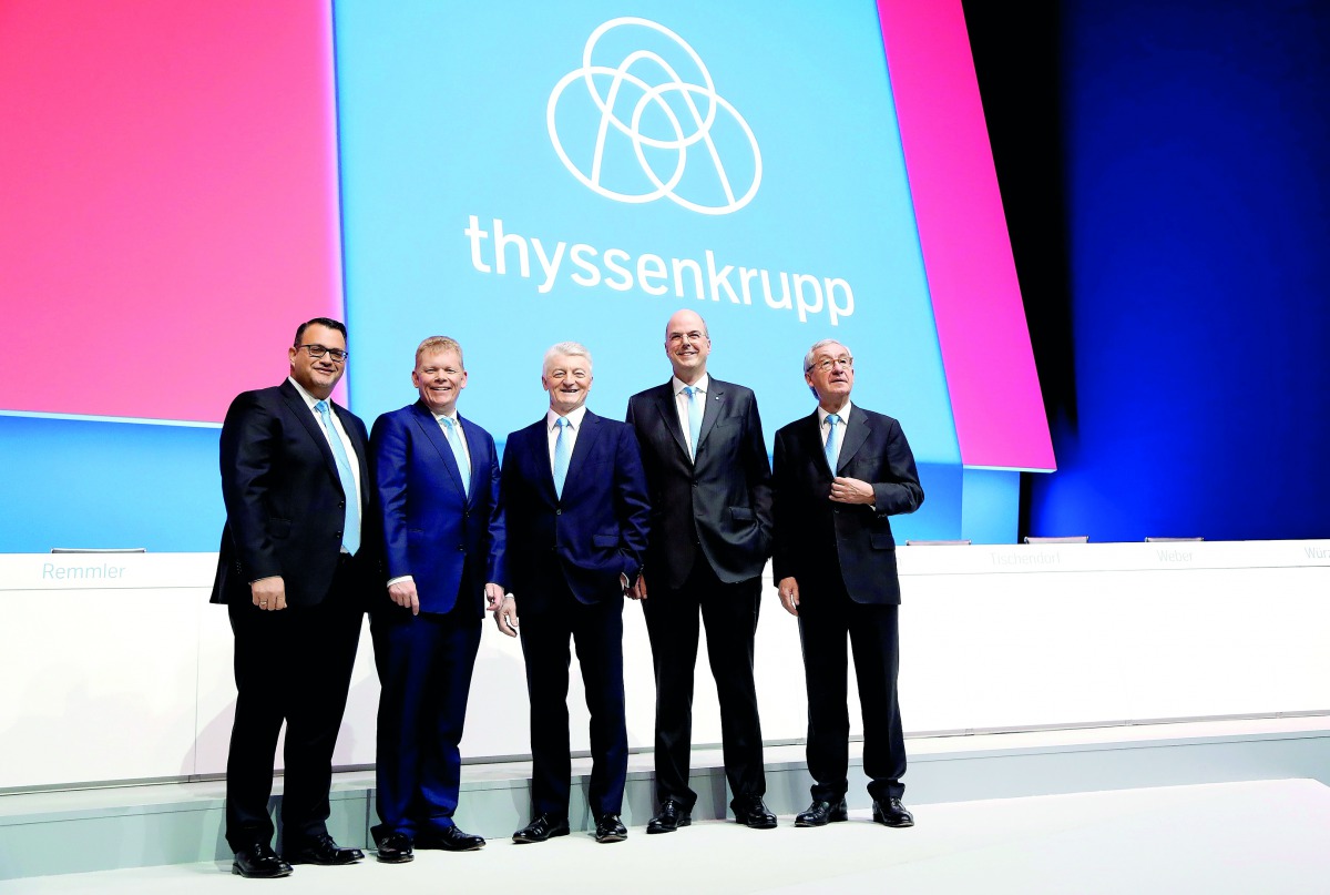 Heinrich Hiesinger (centre), chairman of the board of ThyssenKrupp, with board members Oliver Burkhard (left), Guido Kerkhoff (second left) and Donatus Kaufmann (second right), and Ulrich Lehner (right), chairman of the supervisory board, during the compa
