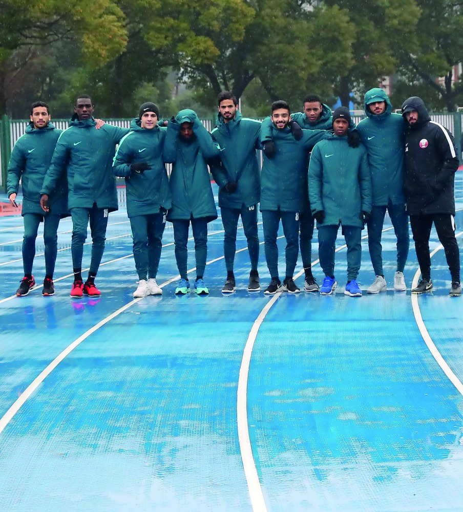 Qatar under-23 football players pose for a photograph following a training session in Changzhou, China yesterday. 