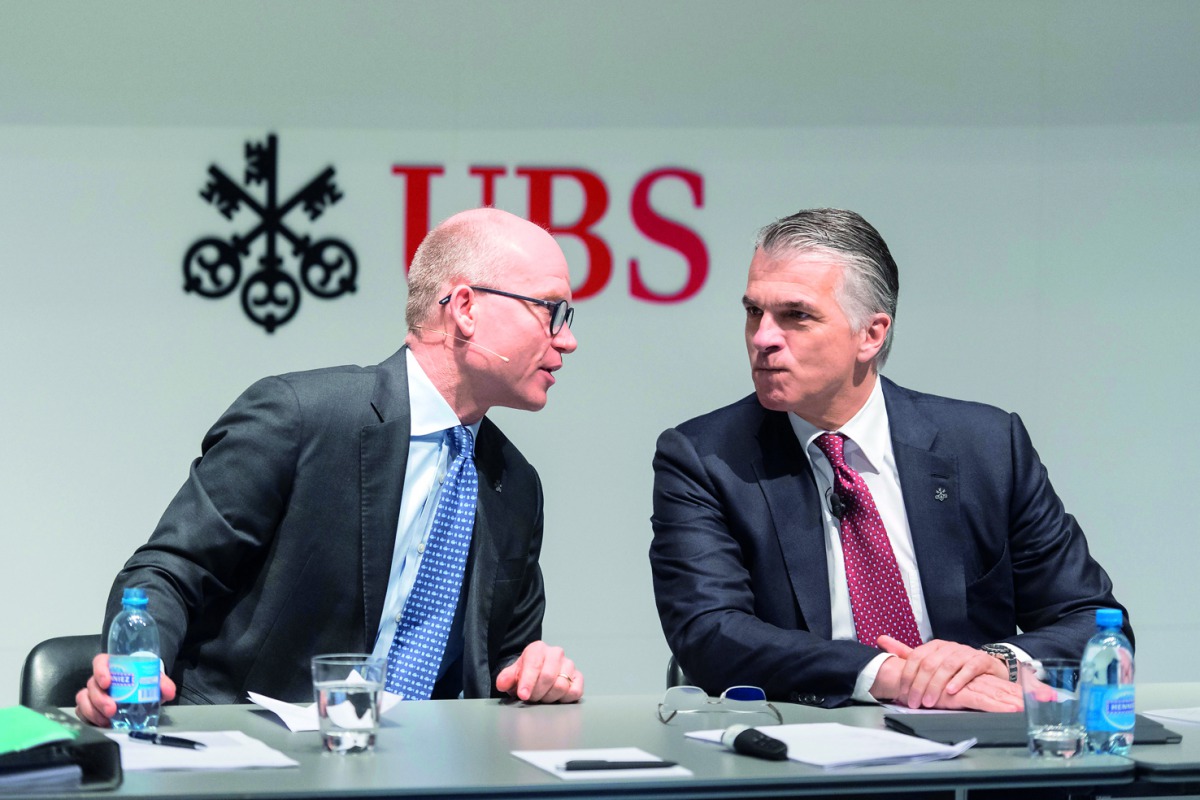 Sergio Ermotti (right) CEO of Switzerland’s bank UBS, speaks with Hubertus Kuelps, Group Head of Communications, during a press conference in Zurich, Switzerland, yesterday.