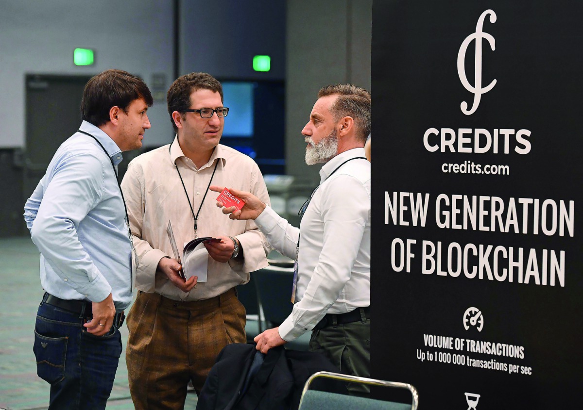 Attendees confer during the Crypto Funding Summit, which helps investors understand cryptocurrency, at the Convention Center in Los Angeles, California on January 24, 2018. Bitcoin, the leading cryptocurrency, is down from record highs approaching $20,000