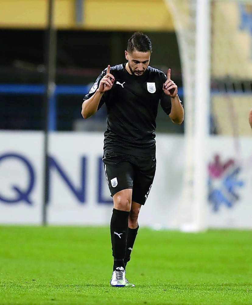 Al Sadd’s Jugurtha Hamroun celebrates his goal against Al Gharafa yesterday. 