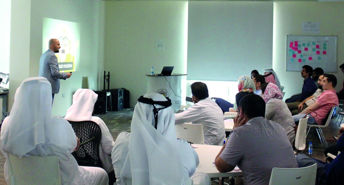 Attendees listening to a speaker during a workshop.