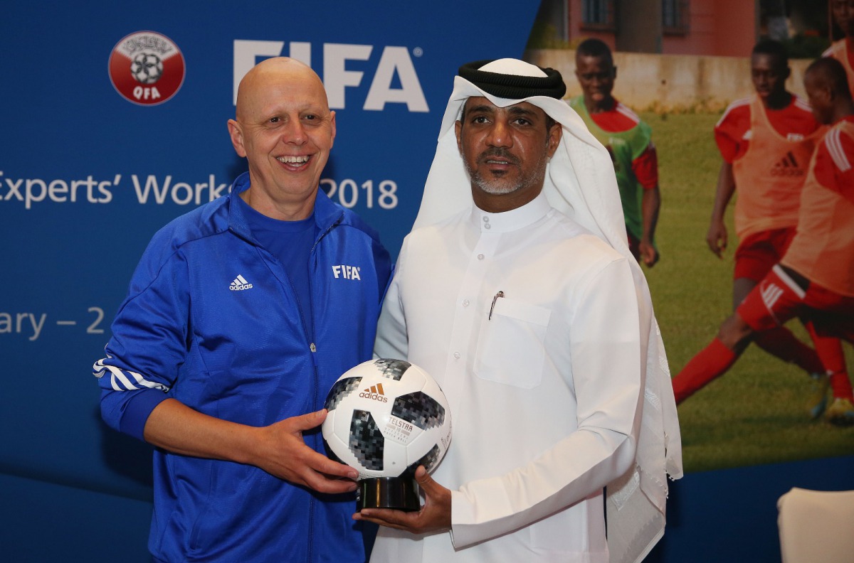 FIFA Technical Director, Steven Martens (left) Gifts Director of Football Development Department at QFA, Fahad Al Zaraa the Official FIFA World Cup Match Ball during the FIFA Technical Experts’ Workshop 2018 at the QFA headquarters yesterday.