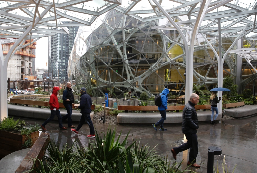 People take a tour during the grand opening of the Amazon Spheres, in Seattle, Washington on January 29, 2018.  AFP / JASON REDMOND
