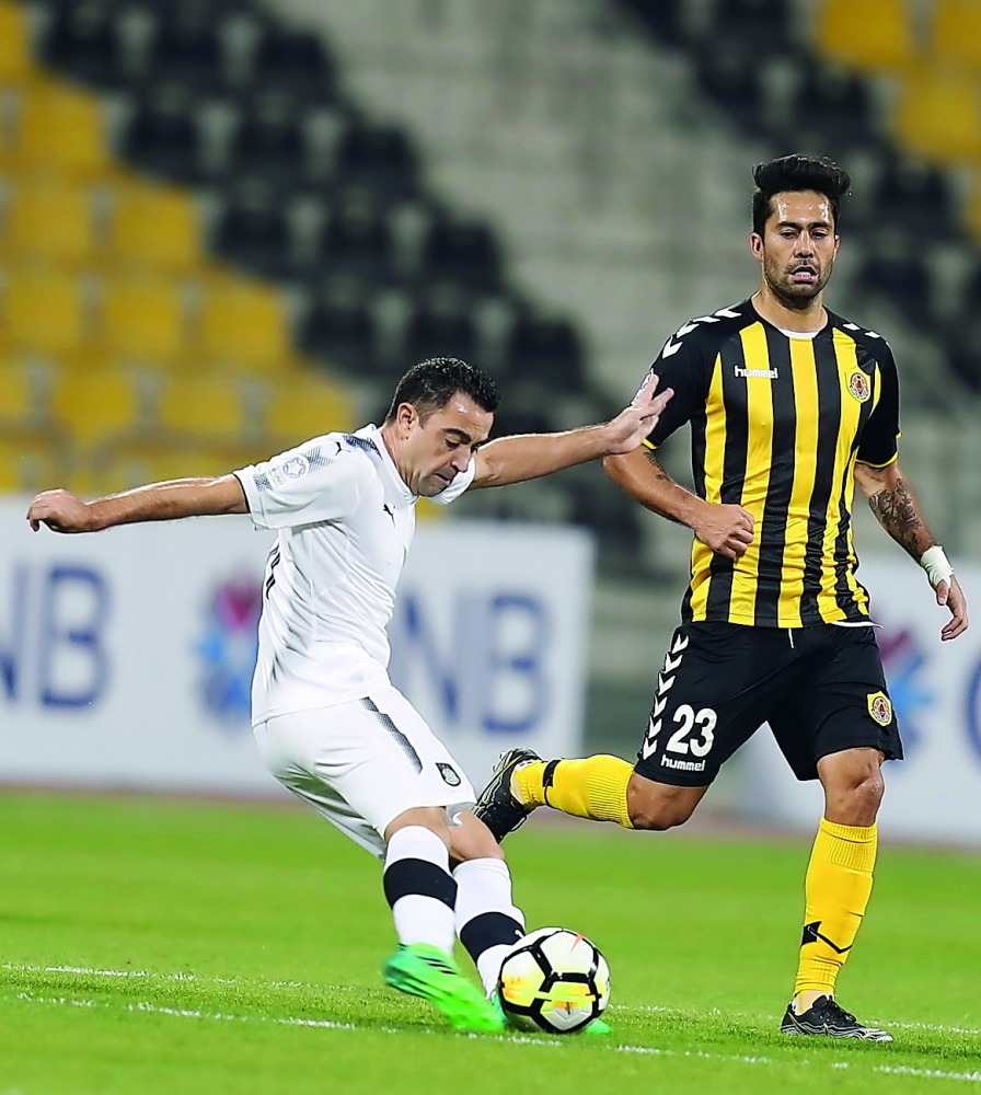 Al Sadd’s Xavi Hernandez shoots to score against Qatar SC during the QNB Stars League match yesterday. Picture by: Mohammed Faraj