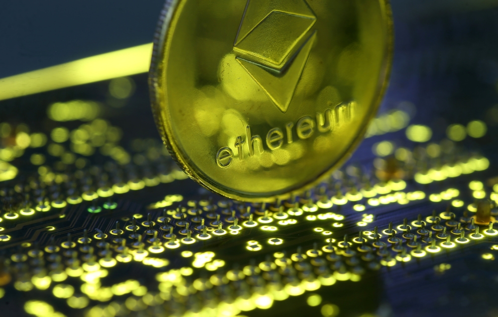 Representation of the Ethereum virtual currency standing on the PC motherboard is seen in this illustration picture, February 3, 2018. Reuters/Dado Ruvic