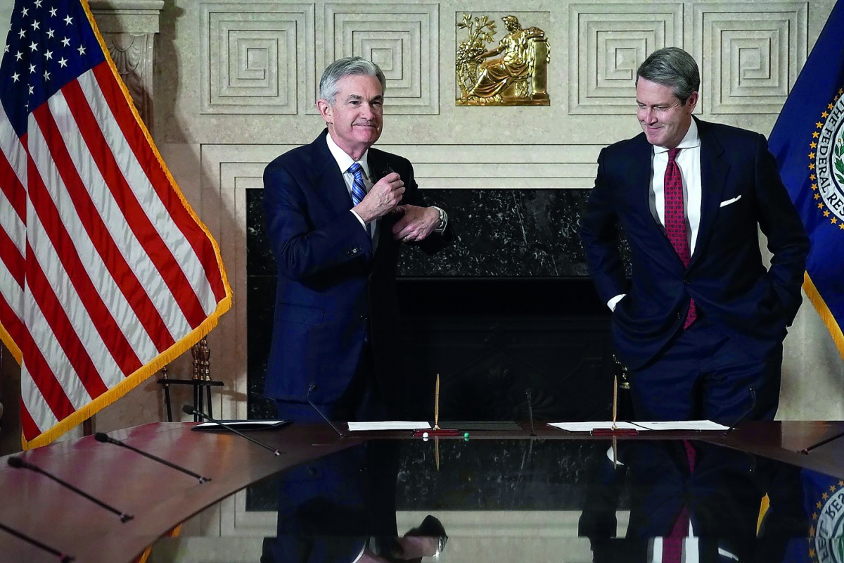 Jerome Powell (left) with Vice Chair for Supervision Randal K Quarles, after he signed documents during a swearing-in ceremony, yesterday, at the Federal Reserve in Washington, DC, the US.
