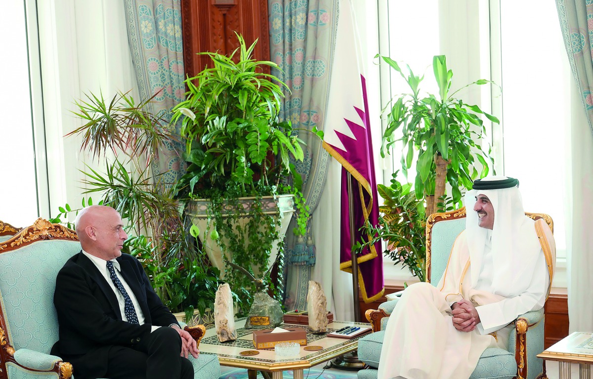 Emir H H Sheikh Tamim bin Hamad Al Thani with the Minister of Interior of the Republic of Italy, Marco Minetti, at the Emiri Diwan yesterday. 