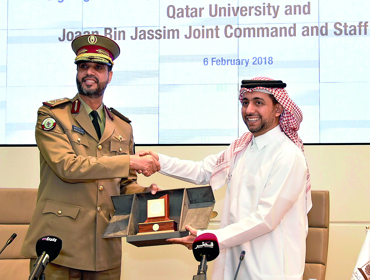 Dr Hassan Al Derham (right) and Major General Staff Mohammed Hamad Mohammed Al Naimi, at the signing event.