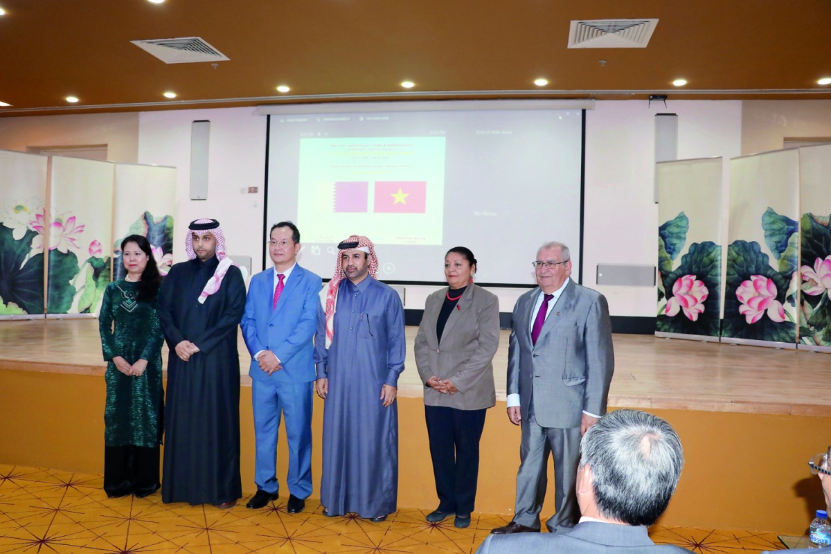 Vietnamese Ambassador Nguyen Dinh Thao (third left), Katara General Manager Dr Khalid bin Ibrahim Al Sulaiti (fourth left) and other officials at the screening of “Yellow Flowers on the Green Grass” at Katara on Tuesday.