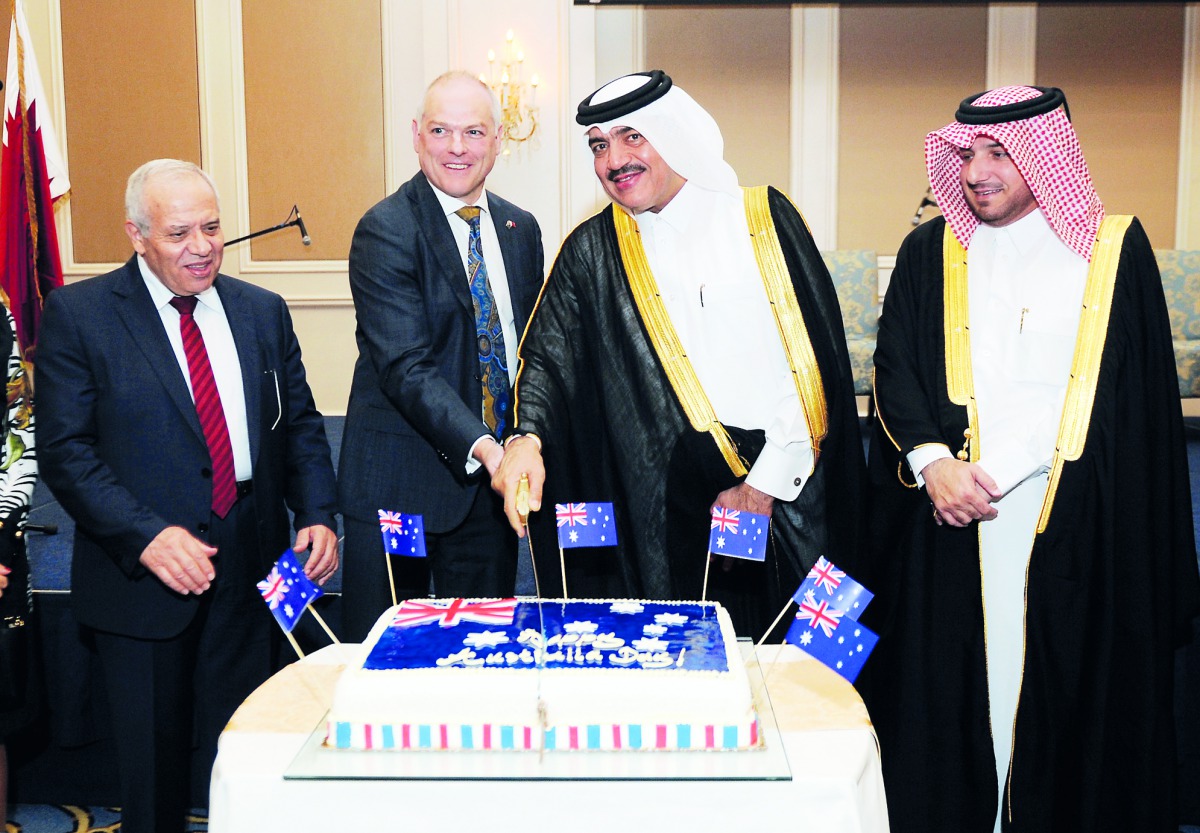 H E Mohamed bin Abdullah Al Rumaihi, Minister of Municipality and Environment (second right) cutting a cake with Dr Axel Wabenhorst (second left), Australian Ambassador to Qatar; and H E Ibrahim Yousif Abdullah Fakhro, Ministry of Foreign Affairs’ Chief o